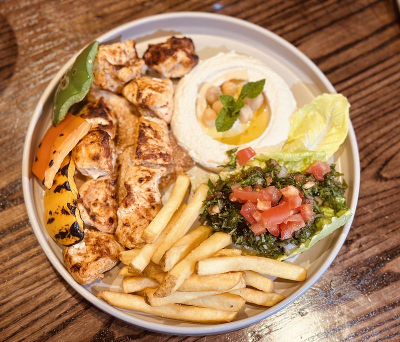 Grilled chicken with houmous, tabbouleh and chips